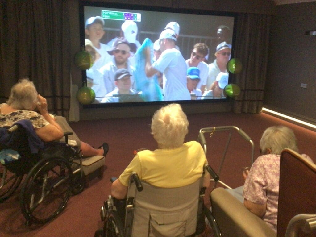 Residents at our Lavender Oaks care home in Sutton watching a Wimbledon match.