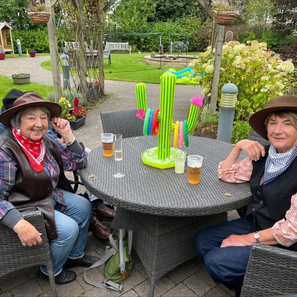 Two of our Haddon Hall care home residents dressed up enjoying our country and western themed garden party.