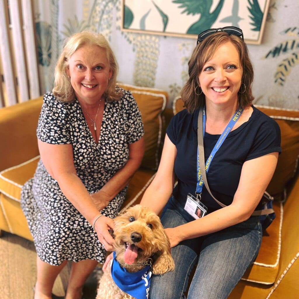Our Elizabeth Gardens care home team with Willow, our new pet therapy dog.